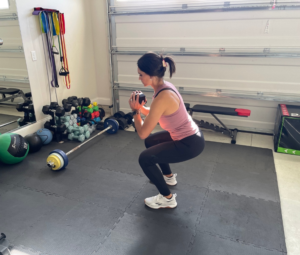 squatting position of the goblet squat exercise