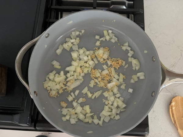 onions and garlic cooking in pan