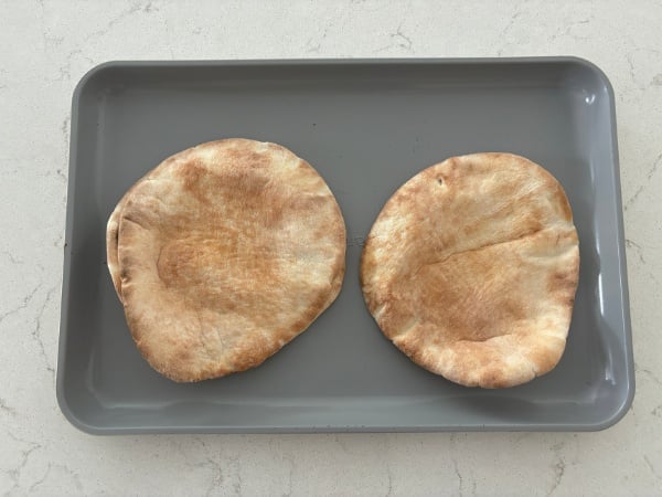 pita breads on the baking pan