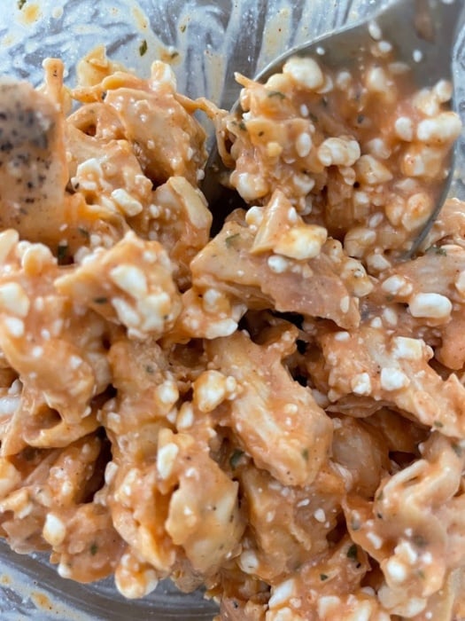 mixing cottage cheese with the chicken