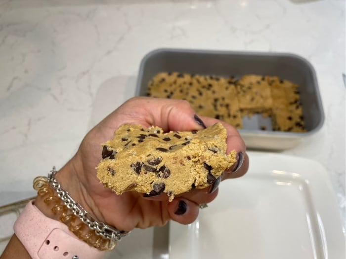 taking a bite of Copycat Perfect Bars