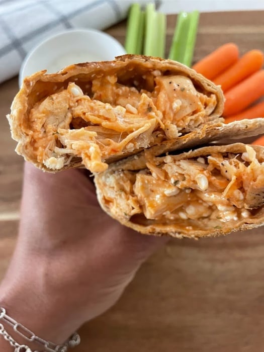 taking a bite of my buffalo chicken wrap