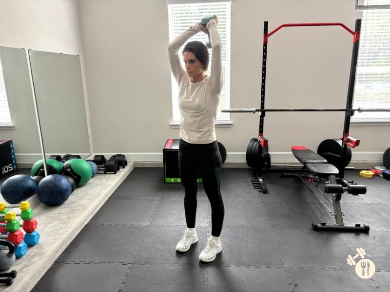 Dumbbell Overhead Tricep Extensions down position Dumbbell Overhead Tricep Extensions down position