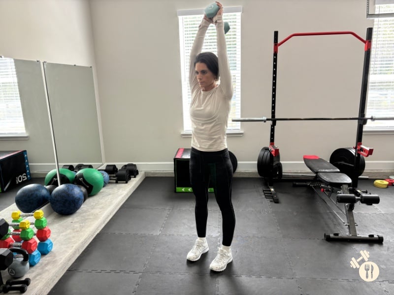 Dumbbell Overhead Tricep Extensions up position Dumbbell Overhead Tricep Extensions up position